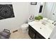 Bathroom with a modern vanity, decorative mirror, and a neutral color scheme at 13616 Whitten N Dr, Fishers, IN 46037