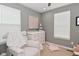 Cozy Bedroom with a glider, neutral color scheme, and soft textures at 13616 Whitten N Dr, Fishers, IN 46037