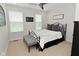 Bedroom with a wrought iron bed frame, plush bedding, and lots of natural light at 13616 Whitten N Dr, Fishers, IN 46037