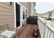A cozy deck features a chair, grill, and view of the street at 13616 Whitten N Dr, Fishers, IN 46037