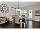 Charming dining area featuring modern lighting, a large wall clock, and ample natural light at 13616 Whitten N Dr, Fishers, IN 46037