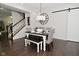 Dining room features hardwood floors, a modern light fixture, and a large clock at 13616 Whitten N Dr, Fishers, IN 46037