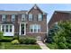 Charming two-story brick home with well-maintained landscaping and inviting front entrance at 13616 Whitten N Dr, Fishers, IN 46037