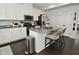 Modern kitchen featuring white cabinets, stainless steel appliances, and granite countertops with an island at 13616 Whitten N Dr, Fishers, IN 46037