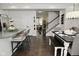 Open concept eat-in kitchen and dining room features modern finishes and hardwood flooring at 13616 Whitten N Dr, Fishers, IN 46037