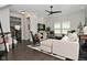 Bright living room featuring modern ceiling fan, hardwood floors, and stylish decor at 13616 Whitten N Dr, Fishers, IN 46037