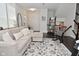 Spacious living room with cozy seating, stylish decor, and elegant hardwood flooring at 13616 Whitten N Dr, Fishers, IN 46037