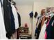 A fully stocked and organized walk-in closet with shelves and hanging clothes at 13616 Whitten N Dr, Fishers, IN 46037