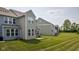 Back view of the townhomes with green grass at 14110 Bay Willow Dr, Fishers, IN 46037