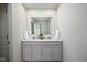 Bathroom featuring double sinks with a large mirror, white cabinetry, and modern fixtures at 14110 Bay Willow Dr, Fishers, IN 46037