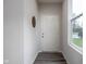 Clean, modern entryway with gray wood floors and a white front door at 14110 Bay Willow Dr, Fishers, IN 46037