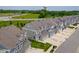 Charming townhomes feature a craftsman-style design, attached garages, and well-maintained landscaping at 14110 Bay Willow Dr, Fishers, IN 46037
