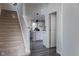 Hallway view of open-concept kitchen and stairs to second level at 14110 Bay Willow Dr, Fishers, IN 46037