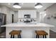 Modern kitchen with stainless appliances, quartz countertops, and open layout with barstool seating at 14110 Bay Willow Dr, Fishers, IN 46037