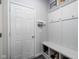 Entryway mudroom with built-in bench, storage cubbies, and convenient coat hooks at 14110 Bay Willow Dr, Fishers, IN 46037