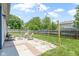 This backyard has a patio with seating, a well-maintained lawn, and a wooden fence at 14255 Holly Berry Cir, Fishers, IN 46038