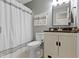 This bathroom has a shower and tub combination, a toilet, a vanity with storage, and neutral gray walls at 14255 Holly Berry Cir, Fishers, IN 46038
