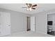 Bright bedroom with gray carpet features two closets and an attached bathroom at 14255 Holly Berry Cir, Fishers, IN 46038