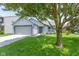 Charming single-story home with a well-maintained lawn and attached two-car garage at 14255 Holly Berry Cir, Fishers, IN 46038