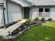 Close-up of the front entryway showcasing landscaping and a walkway at 14255 Holly Berry Cir, Fishers, IN 46038