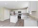 Updated kitchen with stainless steel appliances, granite countertops, and a functional center island at 14255 Holly Berry Cir, Fishers, IN 46038