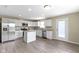 A bright kitchen featuring white cabinets, stainless steel appliances, and an eat-in island at 14255 Holly Berry Cir, Fishers, IN 46038