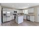 Updated kitchen with stainless steel appliances, granite countertops, and a functional center island at 14255 Holly Berry Cir, Fishers, IN 46038