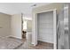 Pantry view shows ample storage next to a stainless steel refrigerator and kitchen area at 14255 Holly Berry Cir, Fishers, IN 46038