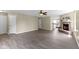 An open living room with a fireplace and view to an adjacent kitchen at 14255 Holly Berry Cir, Fishers, IN 46038