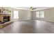 A living room that features large windows, a fireplace, and light-toned floors at 14255 Holly Berry Cir, Fishers, IN 46038