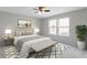 Stylishly furnished bedroom with neutral tones, a ceiling fan, and lots of natural light at 14255 Holly Berry Cir, Fishers, IN 46038