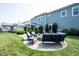 Backyard patio showcases a cozy fire pit area with comfortable seating and landscaped surroundings at 14982 Dawnhaven Dr, Westfield, IN 46074
