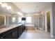 Modern bathroom with a large tub, shower, and granite vanity at 14982 Dawnhaven Dr, Westfield, IN 46074