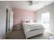 Bright bedroom featuring a comfortable bed, soft carpet, and lots of sunlight at 14982 Dawnhaven Dr, Westfield, IN 46074