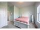 A cozy bedroom with soft, muted colors and natural light from a large window at 14982 Dawnhaven Dr, Westfield, IN 46074