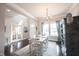 Elegant dining room featuring a chandelier, hardwood floors, and natural light at 14982 Dawnhaven Dr, Westfield, IN 46074