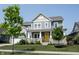 Inviting two-story home boasts a covered porch and a well-maintained front yard at 14982 Dawnhaven Dr, Westfield, IN 46074