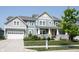 Charming two-story home with covered porch, manicured lawn and inviting curb appeal at 14982 Dawnhaven Dr, Westfield, IN 46074