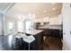 Modern kitchen features large island with bar seating, stainless appliances, and dark hardwood floors at 14982 Dawnhaven Dr, Westfield, IN 46074