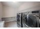 Well-equipped laundry room with modern washer and dryer, offering convenience at 14982 Dawnhaven Dr, Westfield, IN 46074