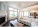 Beautiful, open concept living room and kitchen features hardwood floors and large windows at 14982 Dawnhaven Dr, Westfield, IN 46074