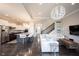 Open concept living space connects a modern kitchen to a large living room with fireplace at 14982 Dawnhaven Dr, Westfield, IN 46074