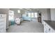 Serene main bedroom boasts large windows, tray ceiling and comfortable furnishings at 14982 Dawnhaven Dr, Westfield, IN 46074