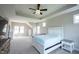 Spacious main bedroom with a tray ceiling, natural light, and neutral color scheme at 14982 Dawnhaven Dr, Westfield, IN 46074