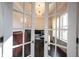 Sunlit office with French doors, modern desk, and stylish decor accents at 14982 Dawnhaven Dr, Westfield, IN 46074