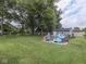 Large backyard with above ground pool and room to entertain with shade trees at 1504 Mcclure Rd, Columbus, IN 47201