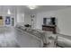 Cozy basement with gray sofa and built-in shelving at 1504 Mcclure Rd, Columbus, IN 47201