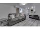 Finished basement with sofa, table and luxury vinyl tile at 1504 Mcclure Rd, Columbus, IN 47201