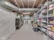 Unfinished basement with ample storage and shelving at 1504 Mcclure Rd, Columbus, IN 47201