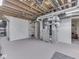 Finished basement area featuring a furnace, shelving and door leading to another part of the basement at 1504 Mcclure Rd, Columbus, IN 47201